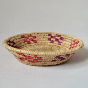 Handmade round fruit and bread bowl from palm straw